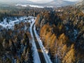 Curvy Road Brodge over Frozen River. Winter Landscape in Mountains. Bieszczady Poland. Drone Top Down View