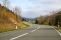 Curvy road between mountains with forest in autumn Royalty Free Stock Photo