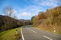 Curvy road between mountains with forest in autumn Royalty Free Stock Photo