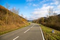 Curvy road between mountains with forest in autumn Royalty Free Stock Photo