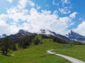 Curvy road in the mountains with mountaintops in background