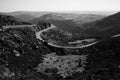 Curvy road in Serra da Estrela, Portugal. Black and white photo. Royalty Free Stock Photo