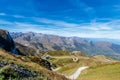 Curvy road up to the mountain under a blue sky in mercantour national park, France