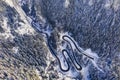 Curvy road in winter forest Royalty Free Stock Photo