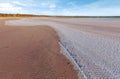 Curvy salt deposits on the beach of pink salt Lake Kenyon Royalty Free Stock Photo