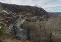 Curvy and sloppy road in the mountains with snow Royalty Free Stock Photo