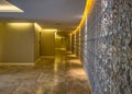 Curvy wall, warm lightend floor at a SPA