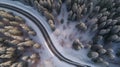 Curvy windy road in snow covered forest top down aerial view Royalty Free Stock Photo