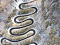 Curvy windy road in snow covered forest Royalty Free Stock Photo