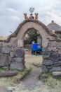 Cusco, Peru - circa June 2015: Stone gate at the Peruvian village in the countryside, Andes Mountains, Peru