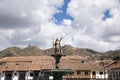 Image of Inka sculpture in Cusco main square. Peruvian city in the Andes. Golden sculpture. Royalty Free Stock Photo