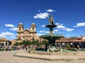 Several tourists admire the view of Plaza de Armas in beautiful and ancient Cusco, Peru. Royalty Free Stock Photo