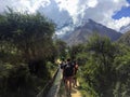 Cusco Province, Peru - May 8th, 2016: A young group of international hikers, led by their local Inca guide, navigate the Andes mo