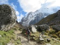 Cusco Province, Peru - May 8th, 2016: A young group of international hikers, led by their local Inca guide, navigate the Andes mo Royalty Free Stock Photo