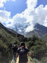 Cusco Province, Peru - May 8th, 2016: A young group of international hikers, led by their local Inca guide, navigate the Andes mo