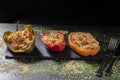 Cuscus, roasted peppers fresh from the oven stuffed with couscous with vegetables dark food version Royalty Free Stock Photo