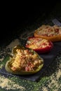 Cuscus, roasted peppers fresh from the oven stuffed with couscous with vegetables dark food version