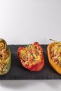 Cuscus, roasted peppers in the oven and stuffed with couscous with vegetables white background Royalty Free Stock Photo