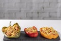 Cuscus, roasted peppers in the oven and stuffed with couscous with vegetables white background Royalty Free Stock Photo