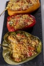 Cuscus, roasted peppers in the oven and stuffed with couscous with vegetables white background