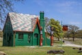 Colorful Retro Phillips 66 Gas Station surrounded by trees with old time signs and pumps Royalty Free Stock Photo