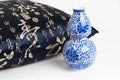 Cushion With Chinese Characters Writing And Blue Ceramic Vase