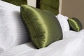 Cushions , Green pillows on bed in a hotel room Royalty Free Stock Photo