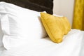 Cushions , Yellow pillows on bed in hotel room Royalty Free Stock Photo