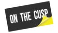 ON  THE  CUSP text on black yellow sticker stamp Royalty Free Stock Photo