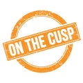 ON THE CUSP text on orange grungy round stamp Royalty Free Stock Photo