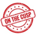 ON THE CUSP text on red grungy round rubber stamp