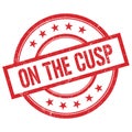 ON THE CUSP text written on red vintage round stamp