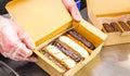 Custard eclairs with dark and light chocolate in a box Royalty Free Stock Photo