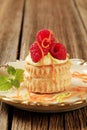 Custard filled puff pastry shell with raspberries Royalty Free Stock Photo
