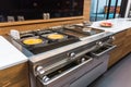 custom-built cooking station with built-in griddle for making pancakes and eggs at the same time Royalty Free Stock Photo