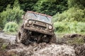 Custom built Off-road Trophy UAZ 469 passing mud pit. Royalty Free Stock Photo