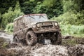 Custom built Off-road Trophy UAZ 469 passing mud pit. Royalty Free Stock Photo