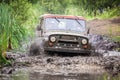 Custom built Off-road Trophy UAZ 469 in the swamp at high speed. Royalty Free Stock Photo