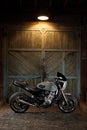 Custom caferacer motorbike on an old garage door background.