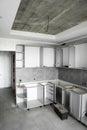 Custom kitchen cabinets installation without a furniture facades mdf. Gray modular kitchen from chipboard material on a Royalty Free Stock Photo