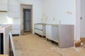 Custom kitchen cabinets in various stages of installation base for island in center Installation kitchen cabinets Royalty Free Stock Photo