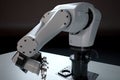 custom robotic hand, with tool-specific gripper for picking up and interacting with objects