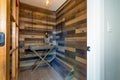 Wine room with wood planked walls.