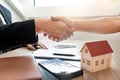 Customer and broker shake hands agreeing to buy new house at meeting after making sale purchase deal or finish buying or rental Royalty Free Stock Photo