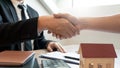 Customer and broker shake hands agreeing to buy new house at meeting after making sale purchase deal or finish buying or rental Royalty Free Stock Photo