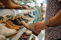 customer browsing through highend summer footwear Royalty Free Stock Photo