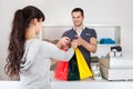 Customer buying clothes in shop