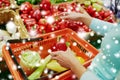 Customer buying peppers at grocery store Royalty Free Stock Photo