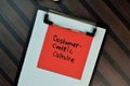 Customer Centric Culture write on sticky notes isolated on Wooden Table Royalty Free Stock Photo
