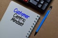 Customer Centric Mindset write on a book isolated on Office Desk